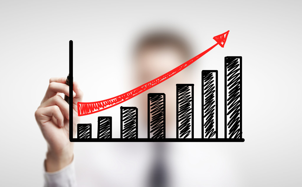 man drawing schedule of business growth